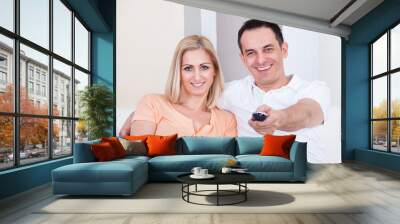 Happy Couple Watching Television Wall mural