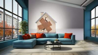 House Model With Crossed Band Aid Wall mural