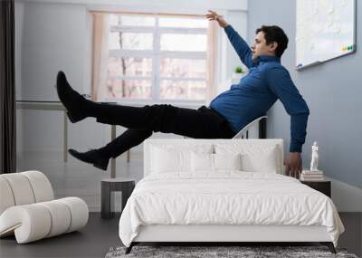 Man Falling On Chair In Office Wall mural