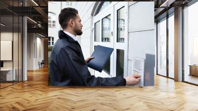 Man Pressing The Door Bell Wall mural