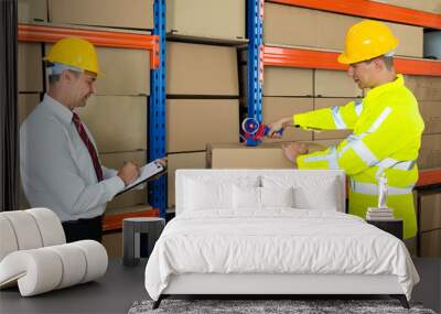 Manager With Clipboard And Worker Taping Box Wall mural