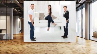 movers carrying sofa with client Wall mural