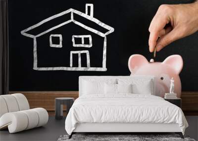 Person Saving Money In Piggybank For Purchasing House Wall mural