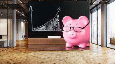 Pink Piggybank With Glasses On Desk Wall mural