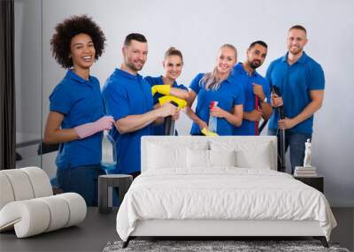 Portrait Of Happy Male And Female Janitors Wall mural