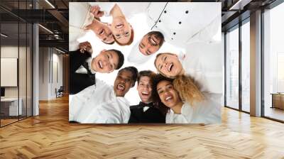 Smiling Restaurant Staff Standing Against White Background Wall mural