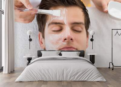 Therapist Applying Face Mask To Man Wall mural