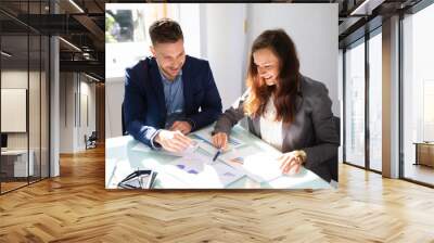 Two Businesspeople Analyzing Graph Wall mural