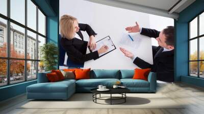 Two Businesspeople Talking With Each Other Wall mural