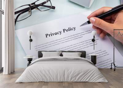 Woman Holding Pen Over Privacy Policy Form Wall mural