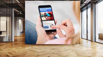 Woman Reading News On Mobile Phone Wall mural