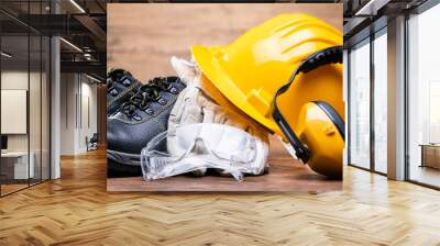 yellow hard hat with safety equipment Wall mural