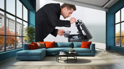 Young Businessman Fixing Cartridge In Photocopy Machine Wall mural