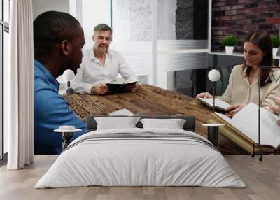 Young Multiethnic People Reading Bible Over Wooden Wall mural