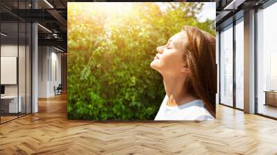 Young Woman Breathing Fresh Air Wall mural