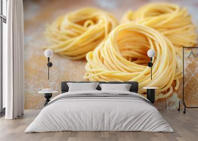 raw homemade spaghetti nest with flour on a wooden table. fresh Italian pasta Wall mural