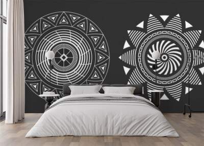 Set of four abstract circular ornaments. Decorative patterns isolated on black background. Tribal ethnic motifs. Stylized sun symbols. Stencil tattoo and prints Vector monochrome illustration. Wall mural