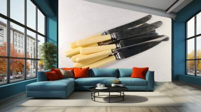 several table knives on the table Wall mural