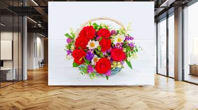 bouquet of garden flowers in a vintage basket on a white background close-up Wall mural