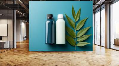 Two medicine bottles mockups and leaf on blue background Wall mural