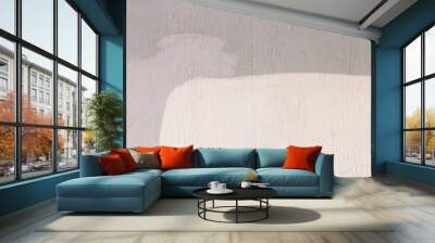 The colored wall is three colors: light warm cream or peach and lilac bright abstract paint background design Wall mural