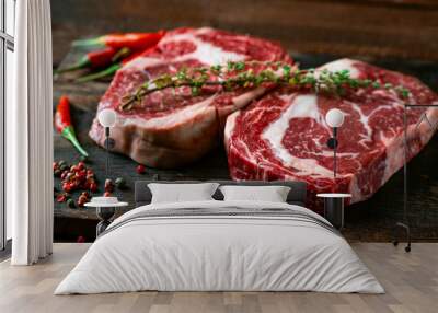 Two classic fresh rib eye steaks on a wooden Board Wall mural