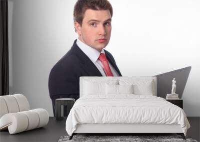 Business man with a laptop isolated over white Wall mural