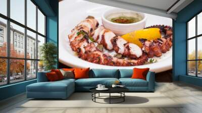 grilled squid rings on a wooden board with sauce Wall mural