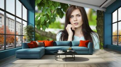 Portrait close up of young beautiful brunette woman Wall mural