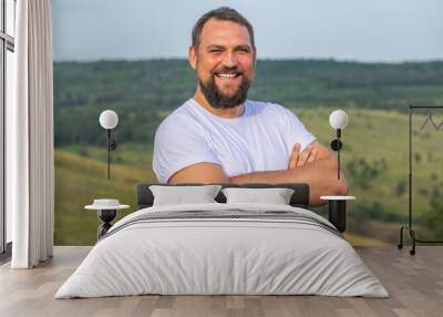 Portrait of a middle-aged brunette man with a thick beard Wall mural