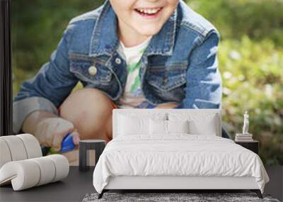 Portrait of a young boy in a jeans jacket Wall mural