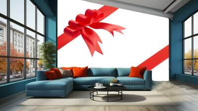 Festive composition for design from an unusual creative fashionable red bow and two red satin ribbons located at the corners of the picture with an copy space for text isolated on white background Wall mural