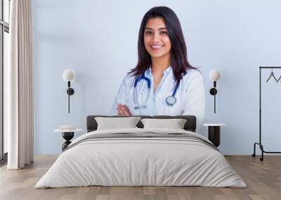 Medical concept of Asian beautiful female doctor in white coat with stethoscope, waist up. Medical student. Woman hospital worker looking at camera and smiling, studio, gray background Wall mural