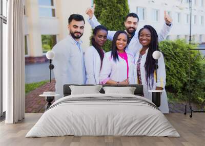 team of foreign friends. group of young african medical workers on background hospital Wall mural