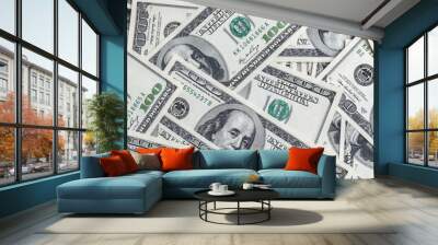 A pile of one hundred US banknotes. Cash of hundred dollar bills, dollar background image. Wall mural