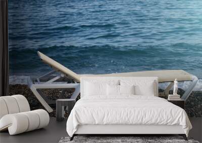 Sunbed on the beach. Sea tour. Wall mural