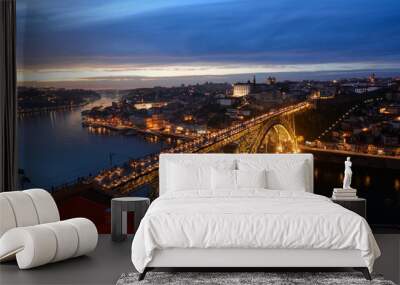 Night skyline of Porto, Portugal, with the Dom Luis I Bridge, a metal arch bridge and symbol of the city, with Douro river and Ribeira district and Porto old town in the background Wall mural