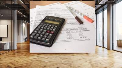 Business composition of bills, calculator, pen and various statistics Wall mural