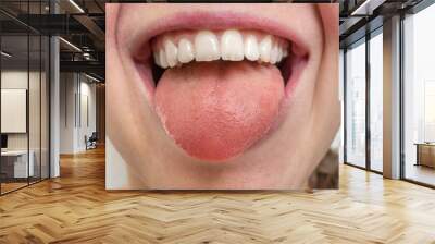 Woman with open mouth showing tongue Wall mural