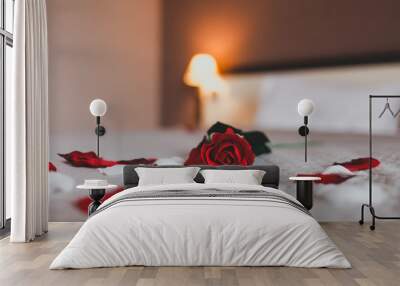  Rose on the bed in the hotel rooms. Rose and her petals on the bed for a romantic evening Wall mural