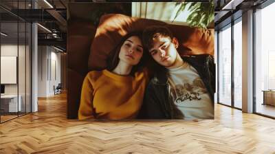 Cozy Moments: Young Couple on a Sofa Wall mural