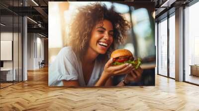 Gourmet Burger Delight: Woman Savoring Every Bite Wall mural