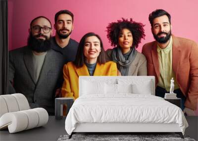 A diverse group of friends posing happily against a pink background Wall mural