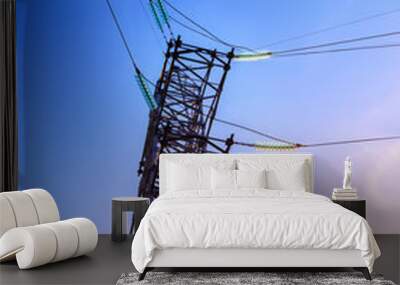 High voltage electricity pylons and transmission power lines on the blue sky background. Wall mural