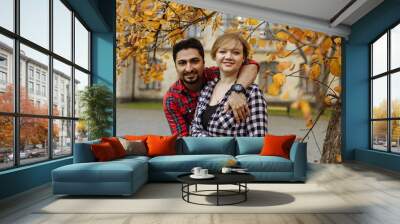 couple of young students on a background of autumn tree Wall mural