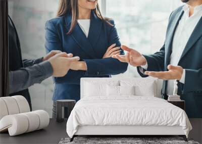 Cropped photo of three successful business people talking in office. Wall mural