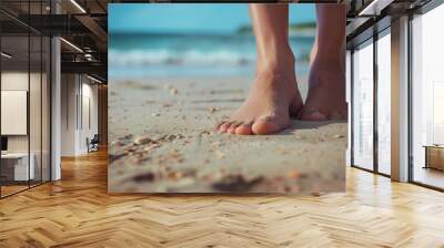 Beautiful female feet on the beach sand Wall mural