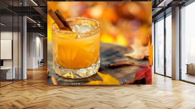 Vanilla cinnamon maple whiskey sour cocktail , autumn leaves on background Wall mural