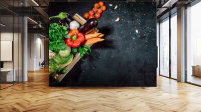 Healthy food background. Concept of healthy food, fresh vegetables in box on a dark background Wall mural