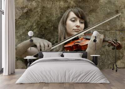 beautiful female violinist playing violin on the grunge backgrou Wall mural